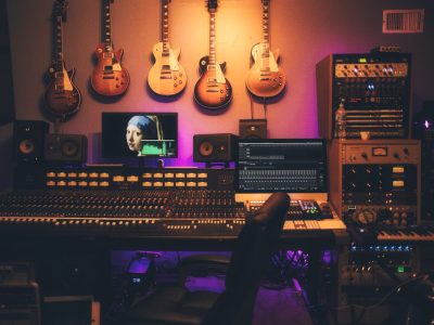 DJ hands on mixing controller electronic music production