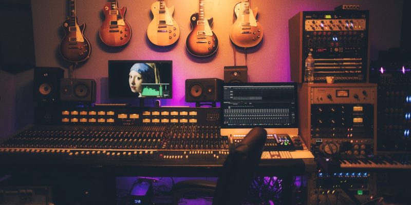 DJ hands on mixing controller electronic music production
